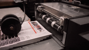 Magazines rolling off a printing press