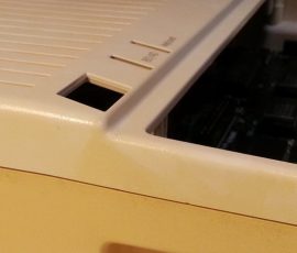 The top and bottom of this case represent the before and after of using Retr0bright. IIc8